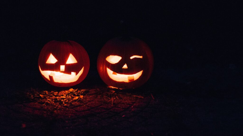Two pumpkins try to scare you.