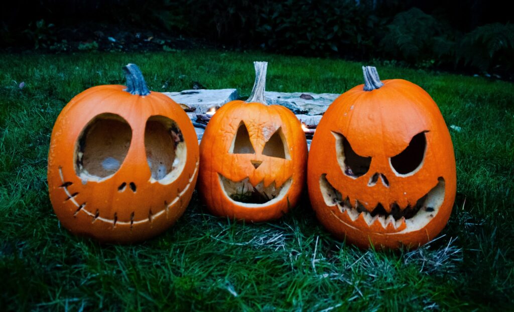 three scary Halloween pumpkins try to scare you 